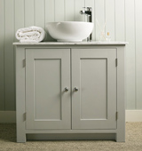 Bathroom vanity cabinet with Carrara Marble top and countertop sink, painted in Modernist White.