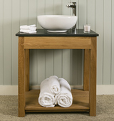 Bathroom washstand in Solid Oak with Honed Black Granite top and countertop sink.